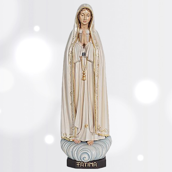 Statua della Madonna di Lourdes, esempio di scultura devozionale con rosario e abito bianco e azzurro.